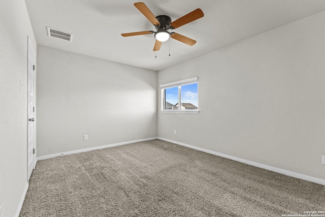 unfurnished room featuring carpet and ceiling fan