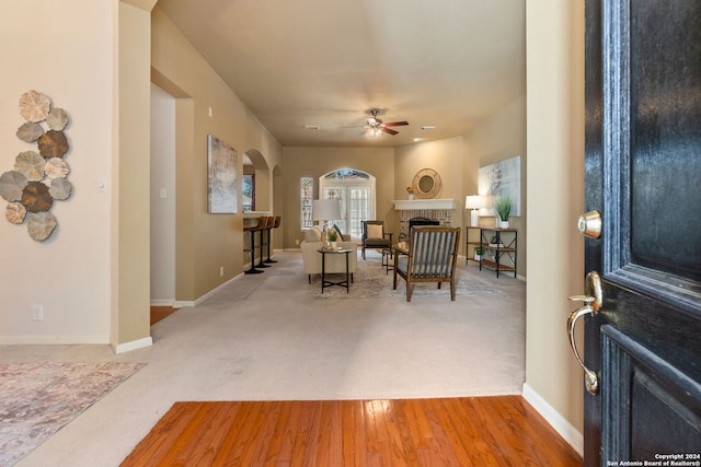 foyer entrance featuring ceiling fan and light hardwood / wood-style flooring