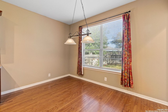 unfurnished room featuring wood-type flooring