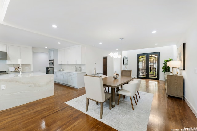 dining room featuring french doors, wood-type flooring, and sink