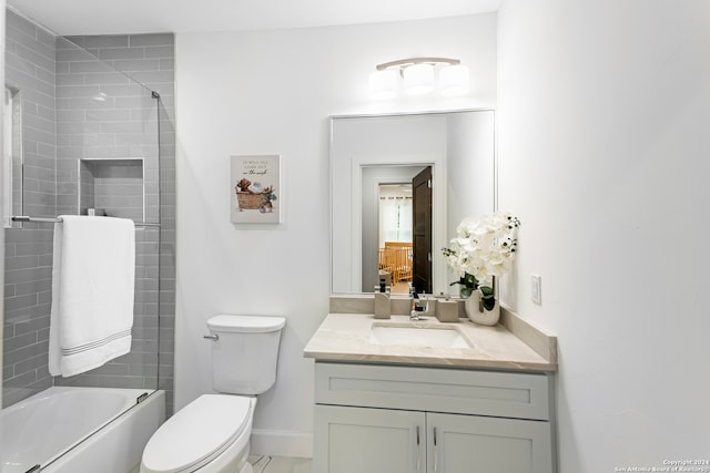 full bathroom featuring vanity, toilet, and tiled shower / bath combo