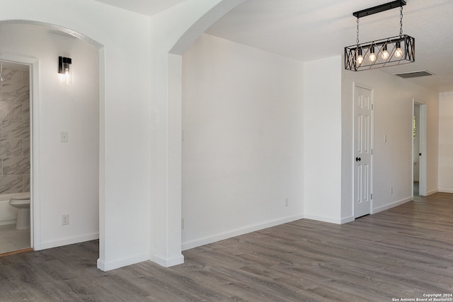 spare room with dark hardwood / wood-style floors