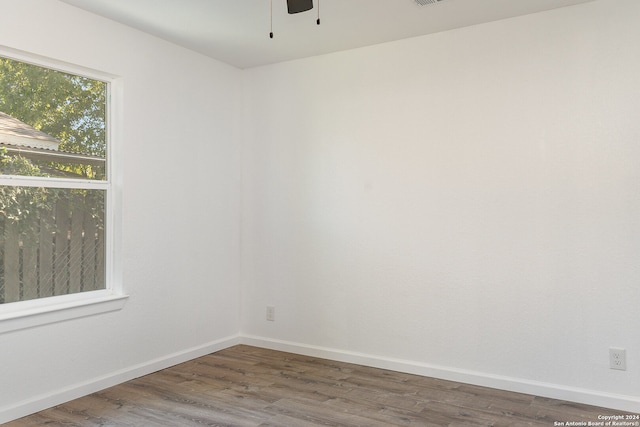 unfurnished room featuring dark hardwood / wood-style floors