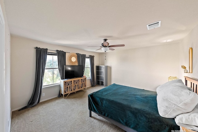 bedroom with ceiling fan and carpet floors