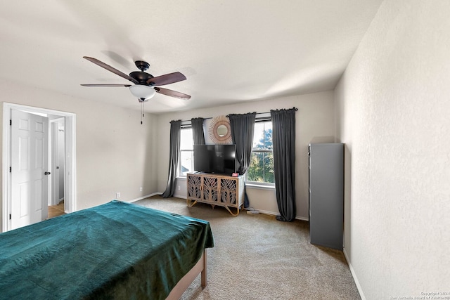 carpeted bedroom with ceiling fan