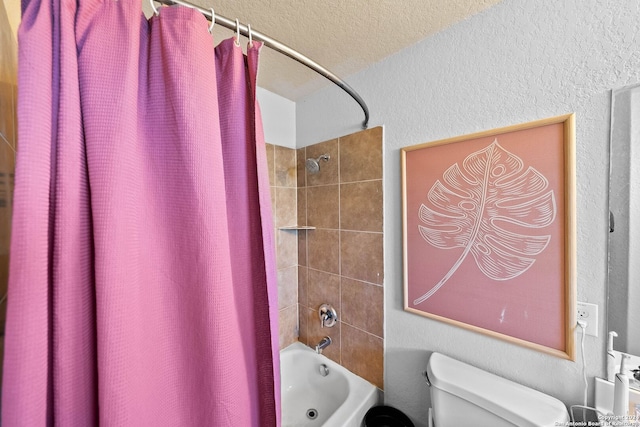 bathroom featuring shower / bath combo, a textured ceiling, and toilet