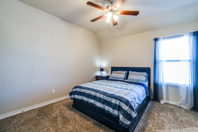 carpeted bedroom with ceiling fan and lofted ceiling