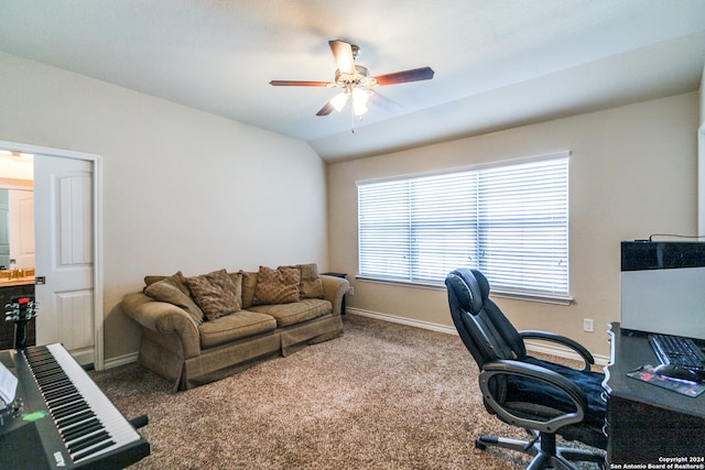 carpeted home office with ceiling fan and lofted ceiling