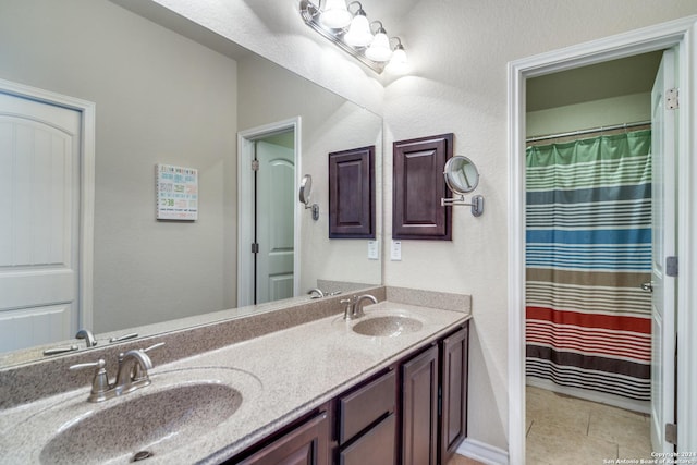 316 English Oaks Cir, Boerne, TX 78006 - full bath with double vanity, tile patterned flooring, and curtained shower