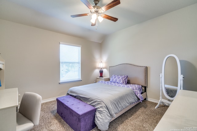 bedroom with ceiling fan, carpet floors, and vaulted ceiling