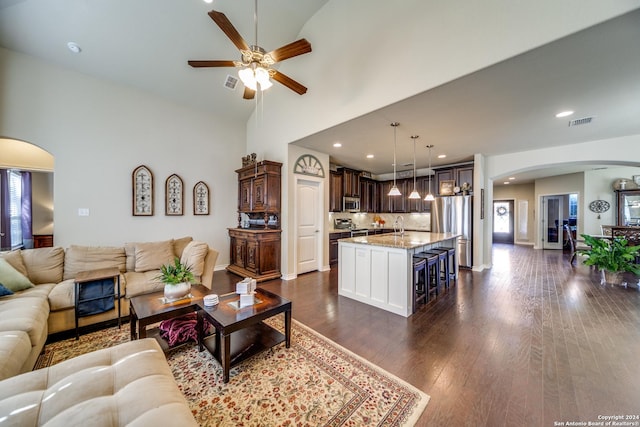 316 English Oaks Cir, Boerne, TX 78006 - living room with arched walkways, ceiling fan, dark wood-style floors, recessed lighting, and baseboards