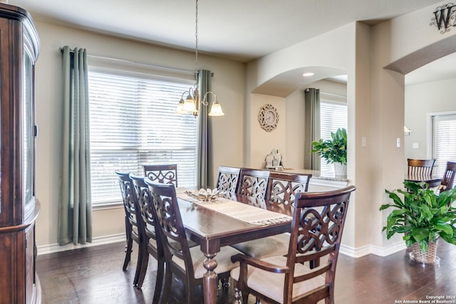 316 English Oaks Cir, Boerne, TX 78006 - dining room with arched walkways, dark wood-style flooring, and baseboards