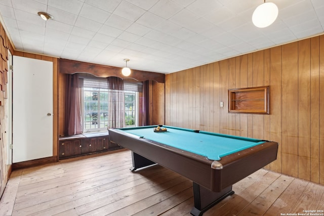 playroom featuring wooden walls, pool table, and light hardwood / wood-style flooring