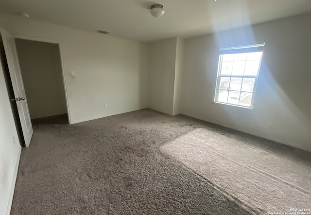 empty room featuring carpet flooring