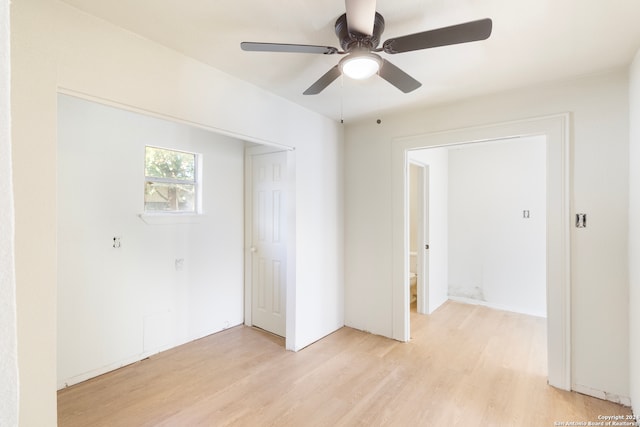 empty room featuring ceiling fan and light hardwood / wood-style flooring