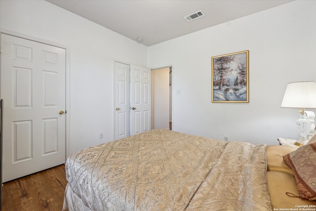 bedroom with hardwood / wood-style flooring