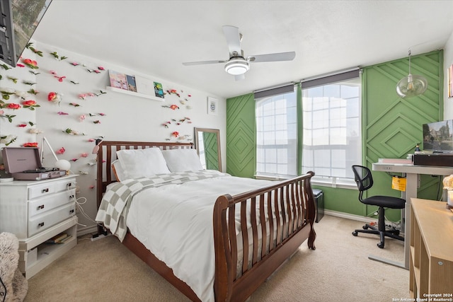 bedroom with ceiling fan and light colored carpet