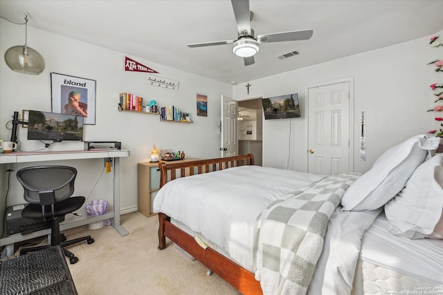 bedroom featuring light colored carpet and ceiling fan