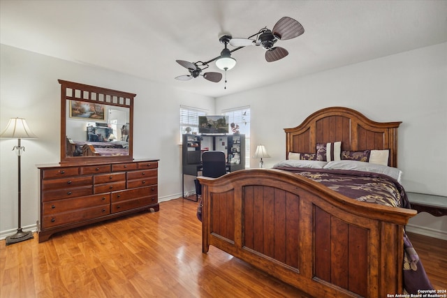 bedroom featuring light hardwood / wood-style floors and ceiling fan