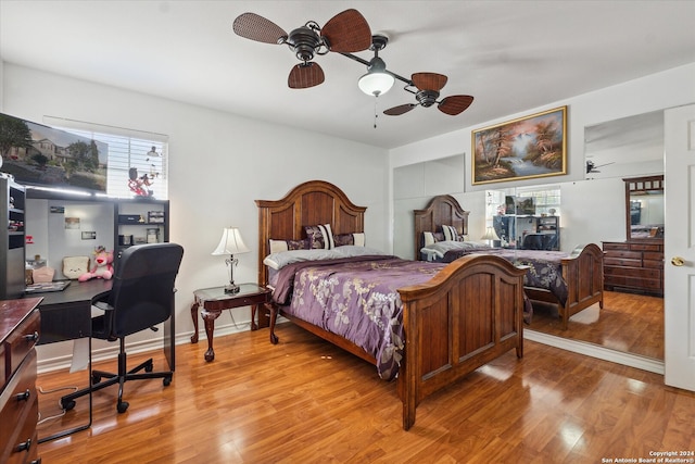 bedroom featuring ceiling fan and light hardwood / wood-style floors