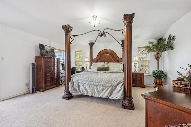 carpeted bedroom featuring vaulted ceiling