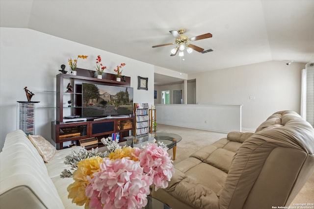 carpeted living room featuring ceiling fan and lofted ceiling