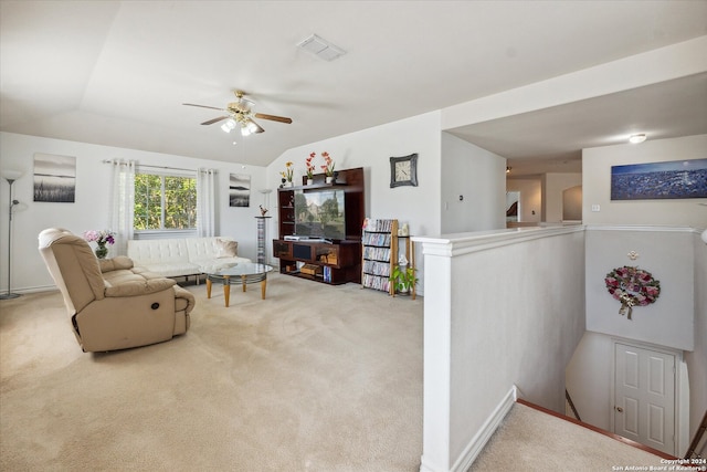 living room featuring ceiling fan, lofted ceiling, and carpet floors