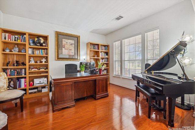 home office featuring hardwood / wood-style floors