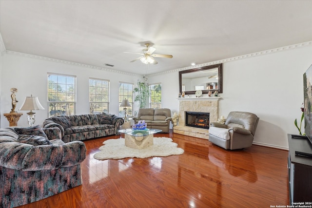 living room featuring ceiling fan, hardwood / wood-style floors, and crown molding