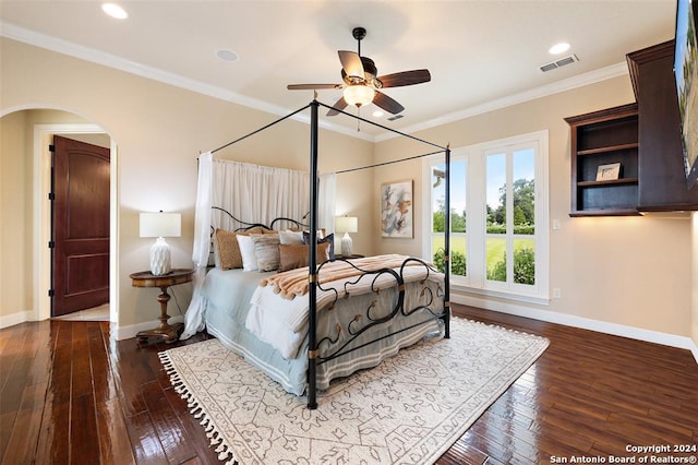 bedroom featuring hardwood / wood-style flooring, ceiling fan, and ornamental molding