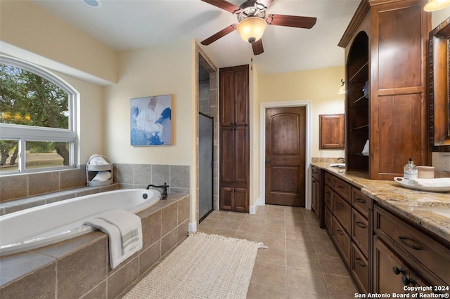 bathroom featuring tile patterned floors, ceiling fan, vanity, and separate shower and tub