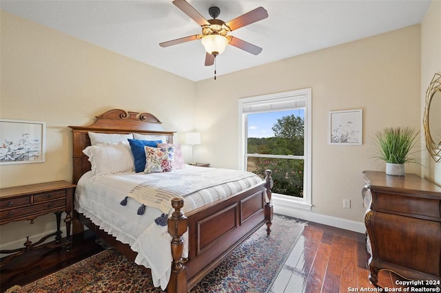 bedroom featuring ceiling fan and dark hardwood / wood-style flooring