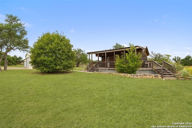 view of yard with covered porch