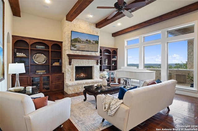 living room with a fireplace, plenty of natural light, and dark wood-type flooring