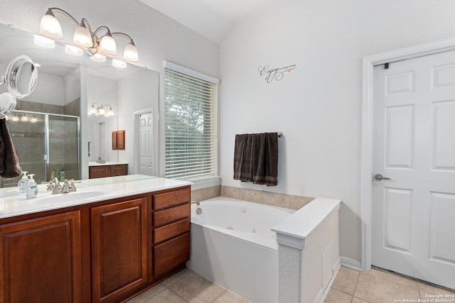 bathroom featuring tile patterned flooring, shower with separate bathtub, vanity, and lofted ceiling