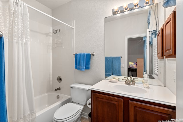 full bathroom featuring shower / bath combo, toilet, and vanity