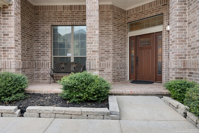 entrance to property with a porch