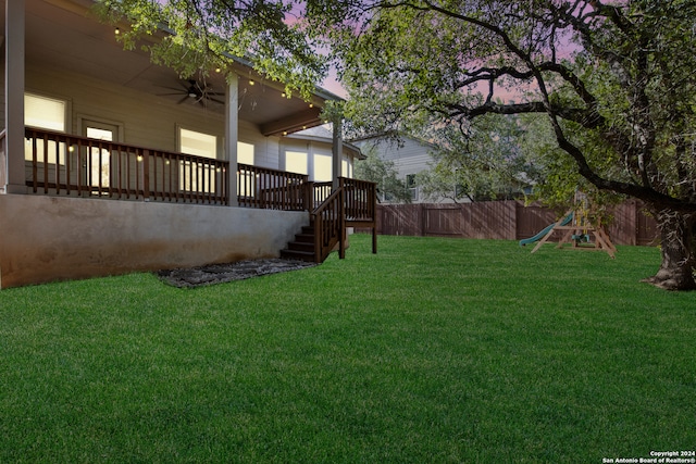 yard at dusk with a deck