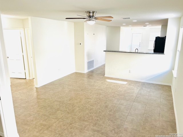 spare room featuring ceiling fan