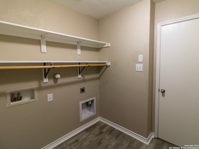 washroom featuring hookup for a washing machine, dark hardwood / wood-style flooring, and electric dryer hookup