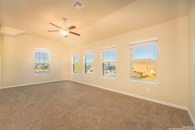 carpeted spare room with ceiling fan and lofted ceiling