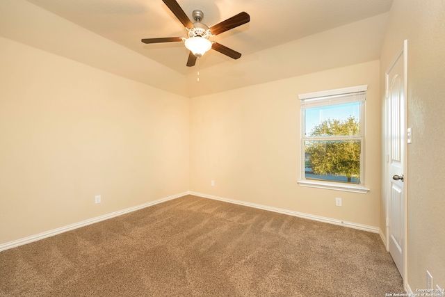 carpeted spare room with ceiling fan