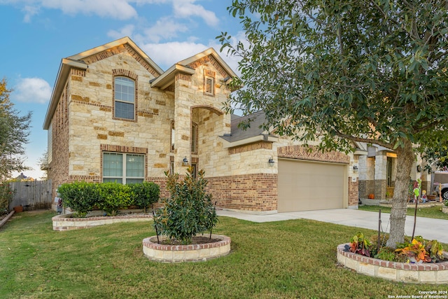 view of front of house with a front yard and a garage