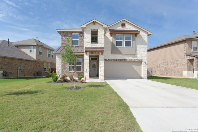 view of front of home featuring central air condition unit, a front yard, and a garage