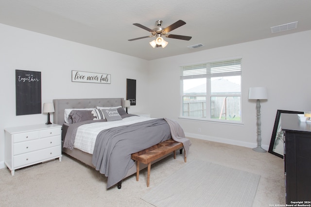 carpeted bedroom with ceiling fan