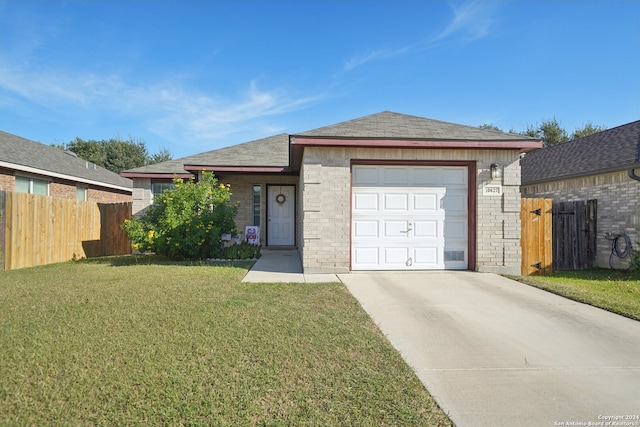 view of front facade with a front lawn and a garage