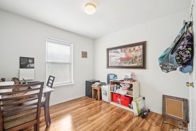 office with light wood-type flooring