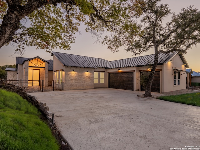 modern farmhouse style home featuring a garage