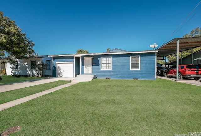 view of front of property featuring a garage and a front lawn