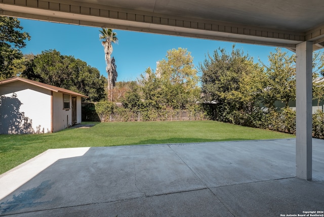 view of patio / terrace with a shed